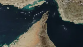 A satellite image of the Strait of Hormuz and Musandam Peninsula — the waterway the US Navy began blockading on April 13, 2026, after peace talks in Islamabad collapsed, in an effort to choke off Iranian trade and pressure Tehran back to the negotiating table.
