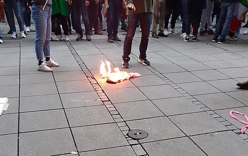 Iranian protesters in the streets, with the government shutting down internet access in January 2026 to suppress the growing unrest.