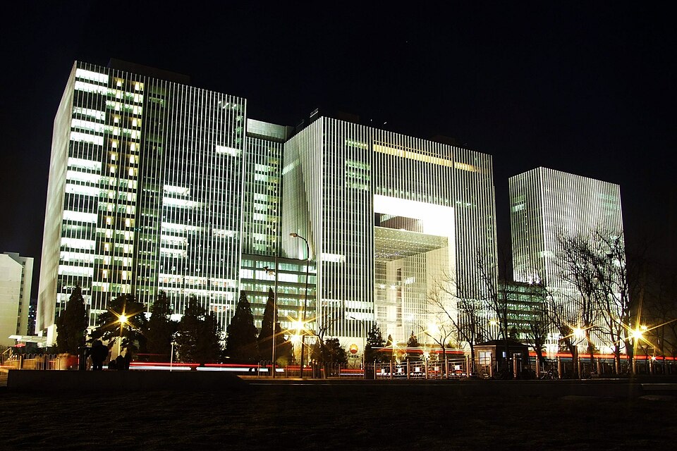 The headquarters of China National Petroleum Corporation (CNPC) in Beijing. China, which secretly imports up to 90% of Iran's seaborne crude via a shadow fleet, directly warned the US on April 14, 2026 that the Strait of Hormuz "is open to us" — a pointed challenge to the legality of the US naval blockade.