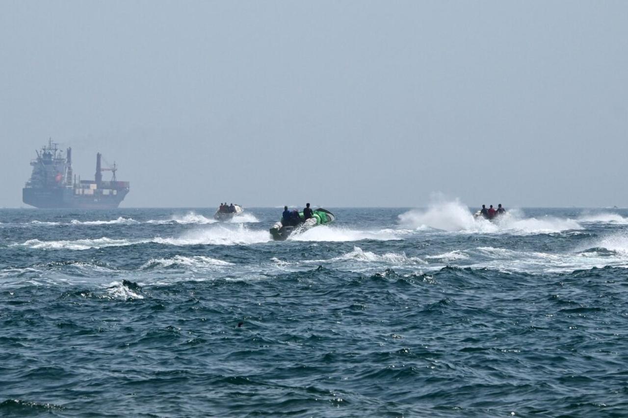 Iranian Revolutionary Guard Corps (IRGC) naval forces escort the seized container vessel Epaminodas through the Strait of Hormuz toward Iranian coastal waters, April 22, 2026, as Iran seized two international ships in a direct counter-move to the US naval blockade. (Turkiye Today / IRGC)